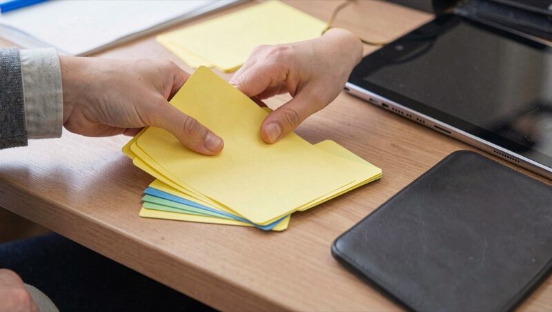 Sorting blank index cards is one way to organize notes before they become hard to find.